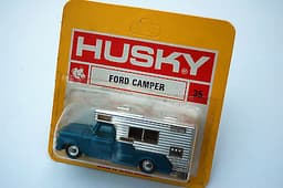 Old shop stock. Mint HUSKY models No.35 FORD CAMPER within red & yellow blister