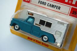 Old shop stock. Mint HUSKY models No.35 FORD CAMPER within red & yellow blister