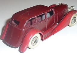 Superb pre war Dinky 24b limousine in maroon with red chassis.