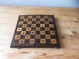 antique travel chess set with bone pieces