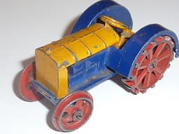 Pre war Dinky 22e Tractor in blue, yellow and red.