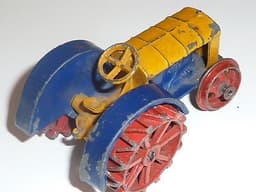 Pre war Dinky 22e Tractor in blue, yellow and red.