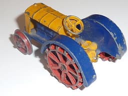Pre war Dinky 22e Tractor in blue, yellow and red.
