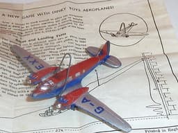 Pre war Dinky 62k King\'s Aeroplane. Boxed + gliding game frame + instructions.