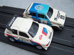 2 TOMY AURORA AFX 1:64 SCALE RALLY SLOT CARS PEUGEOT 205 TURBO & VW GOLF GTI VGC