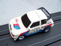 2 TOMY AURORA AFX 1:64 SCALE RALLY SLOT CARS PEUGEOT 205 TURBO & VW GOLF GTI VGC
