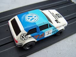 2 TOMY AURORA AFX 1:64 SCALE RALLY SLOT CARS PEUGEOT 205 TURBO & VW GOLF GTI VGC