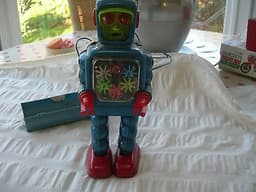 Vintage Tin-Plate Robot - Battery Operated. Made by Yoshiya ? in Japan.