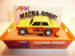 AURORA AFX SLOT CAR MINT IN ORIGINAL CASE. BANDED AND NEVER REMOVED FROM PACKAGE