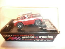 AURORA AFX SLOT CAR MINT IN ORIGINAL CASE. BANDED AND NEVER REMOVED FROM PACKAGE