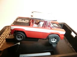 AURORA AFX SLOT CAR MINT IN ORIGINAL CASE. BANDED AND NEVER REMOVED FROM PACKAGE