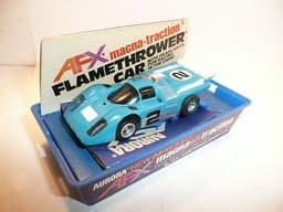 AURORA AFX SLOT CAR MINT IN ORIGINAL CASE. BANDED AND NEVER REMOVED FROM PACKAGE