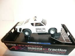 AURORA AFX SLOT CAR MINT IN ORIGINAL CASE. BANDED AND NEVER REMOVED FROM PACKAGE