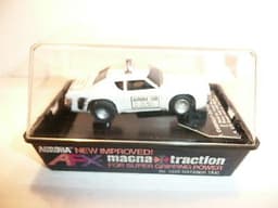 AURORA AFX SLOT CAR MINT IN ORIGINAL CASE. BANDED AND NEVER REMOVED FROM PACKAGE